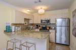 Spacious, well stocked kitchen is equipped with coffee maker, dishwasher, toaster and more